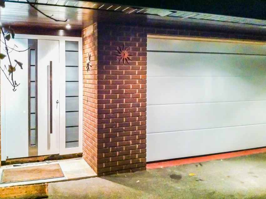 Sectional garage door and front door