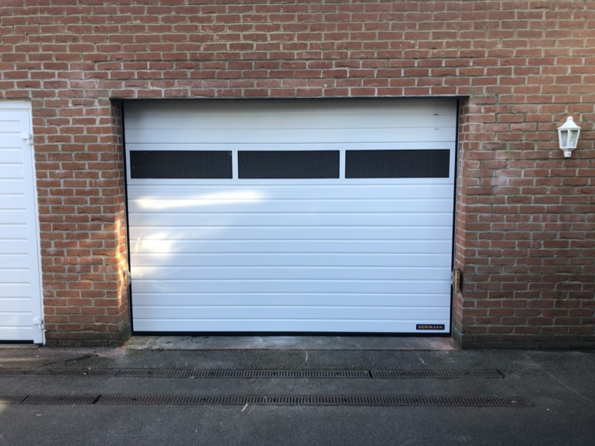 Sectional garage door with window